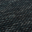 Teppich Odis in Graugrün & Schwarz aus 87% Schurwolle & 9% Baumwolle & 4% Polyester | Entdecken Sie unsere schönsten Wohnaccessoires