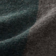 Wolldecke Karby in Dunkelgrün & Grau-Melange aus 100% Schurwolle | Entdecken Sie unsere schönsten Wohnaccessoires